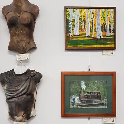 Sculptures and paintings on display in the gallery